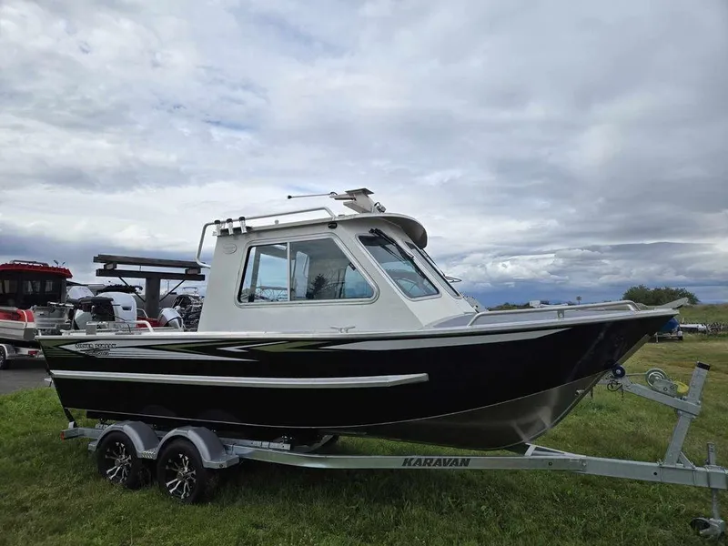 Slide: The Image of 2024 Silver Streak RENFREW boat on Karavan trailer, parked on grass. - 5
