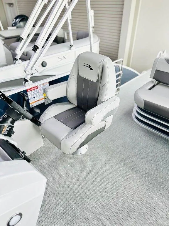 Slide: The Image of Captain's chair on a 2025 Bennington 24 SXSB pontoon boat. - 1