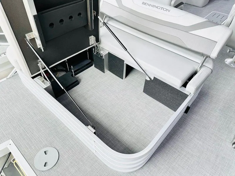 Slide: The Image of 2025 Bennington 24 SXSB boat storage compartment with open seat. - 9