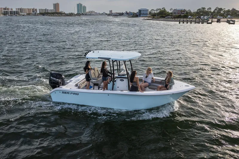 Slide: The Image of 2024 Sea Pro 222 Center Console boat cruising with passengers on a sunny day. - 11