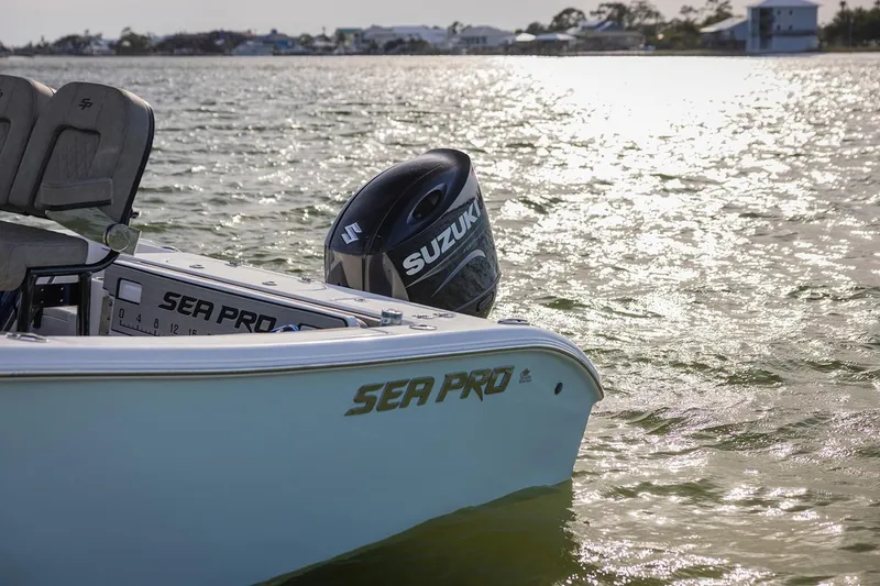 Slide: The Image of 2024 Sea Pro 222 Center Console boat with Suzuki outboard motor on water. - 12