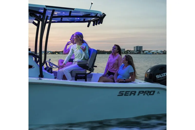 Slide: The Image of 2024 Sea Pro 222 Center Console boat with people enjoying a sunset ride. - 14