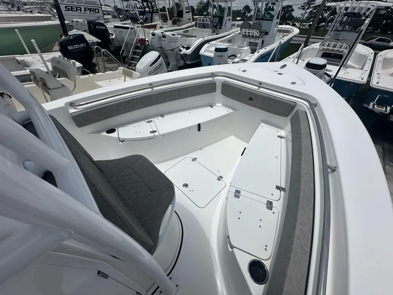 Slide: The Image of 2024 Sea Pro 222 Center Console boat interior with seating and storage compartments. - 5