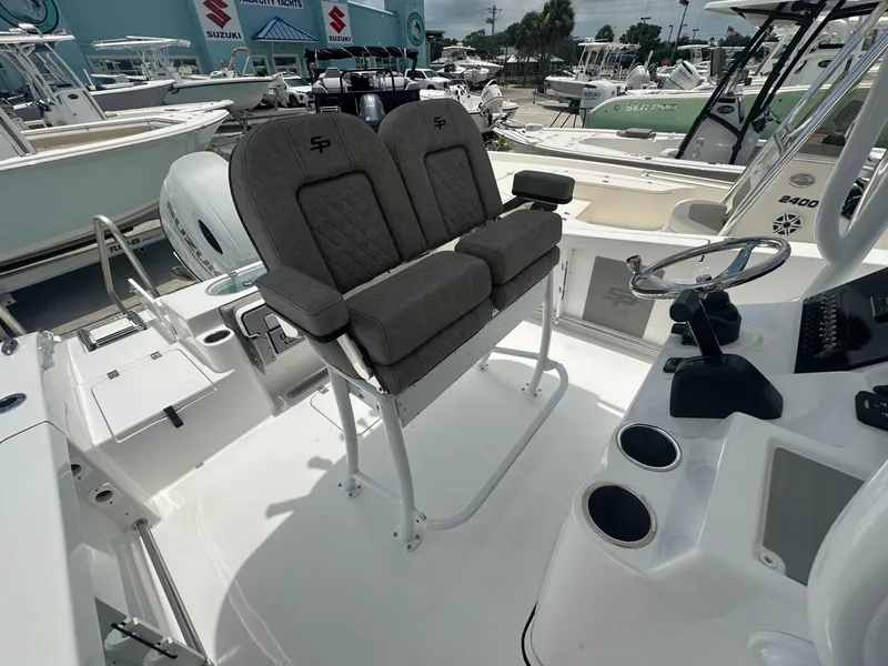 Slide: The Image of 2024 Sea Pro 222 Center Console boat interior with dual seats and steering console. - 8