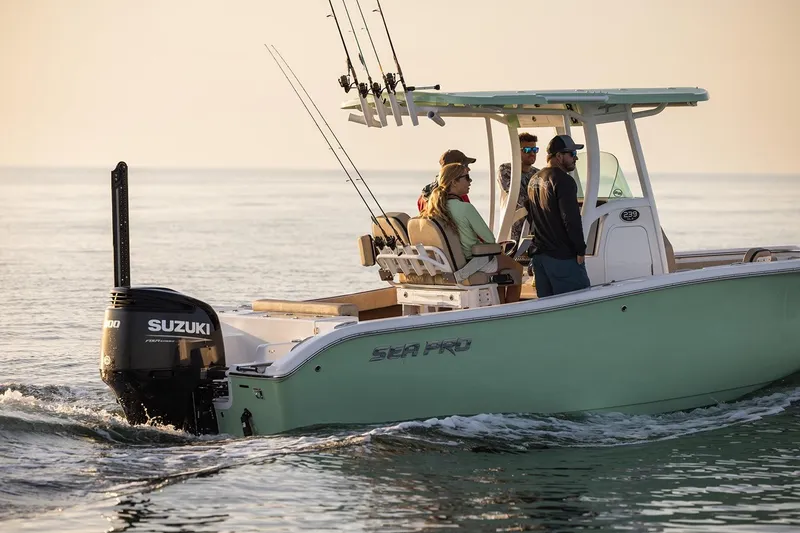 Slide: The Image of 2024 Sea Pro 242 Center Console boat with Suzuki engine on calm water. - 12