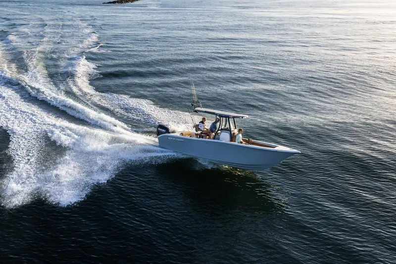Slide: The Image of 2024 Sea Pro 242 Center Console boat cruising on open water. - 13