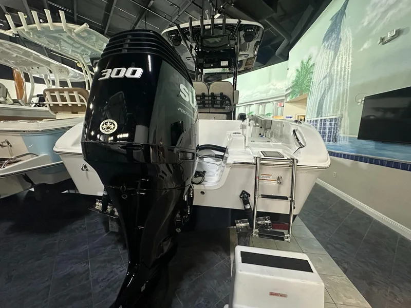 Slide: The Image of 2024 Sea Pro 242 Center Console boat with a powerful 300 horsepower engine on display. - 3