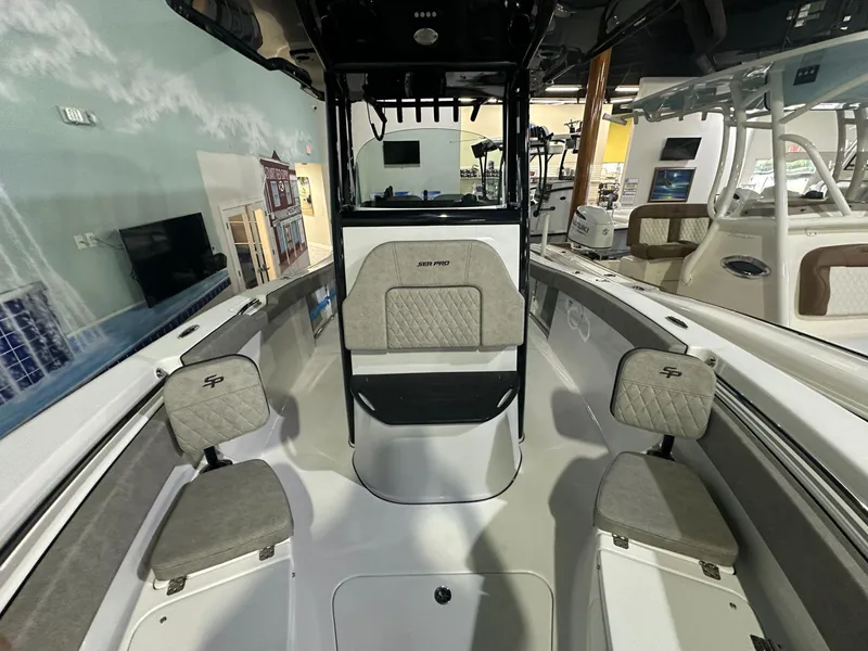 Slide: The Image of 2024 Sea Pro 242 Center Console boat interior with seating and console. - 6