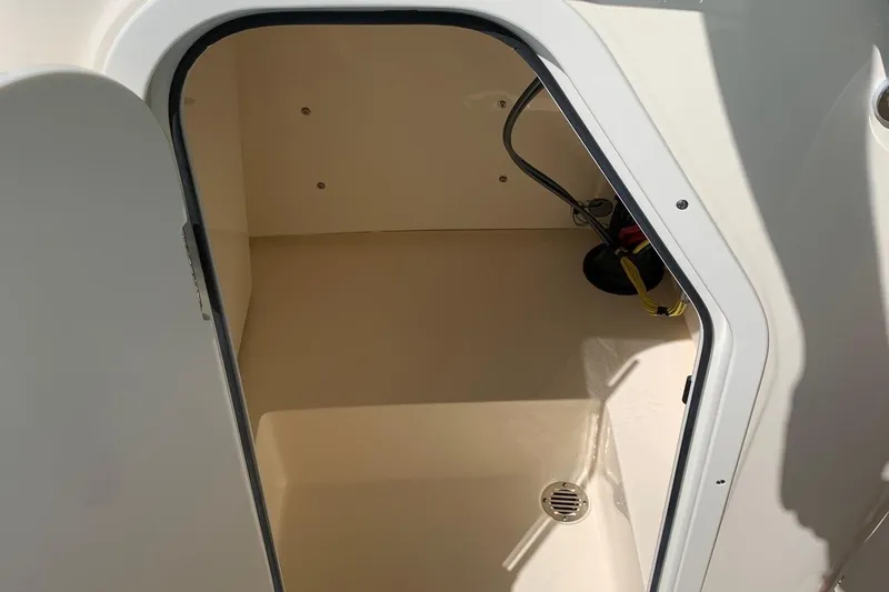 Slide: The Image of 2024 Scout 195 Sportfish storage compartment with drainage - 6