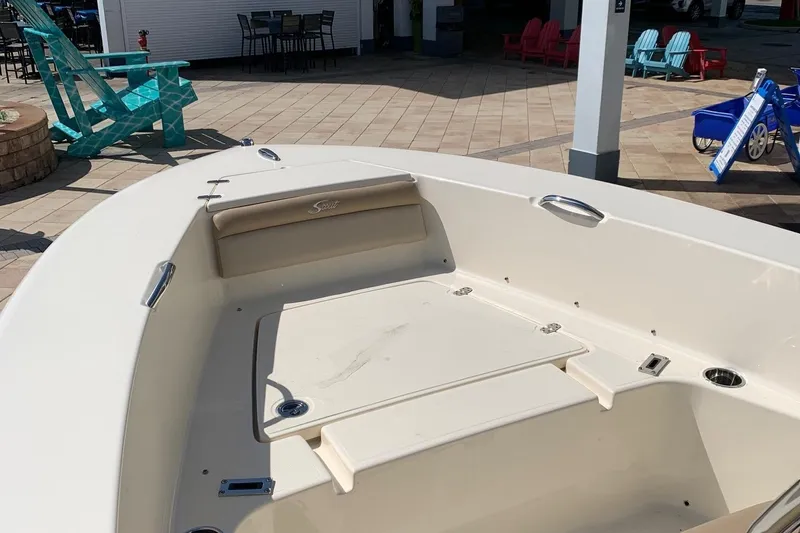 Slide: The Image of 2024 Scout 195 Sportfish boat interior with seating and storage compartments. - 9