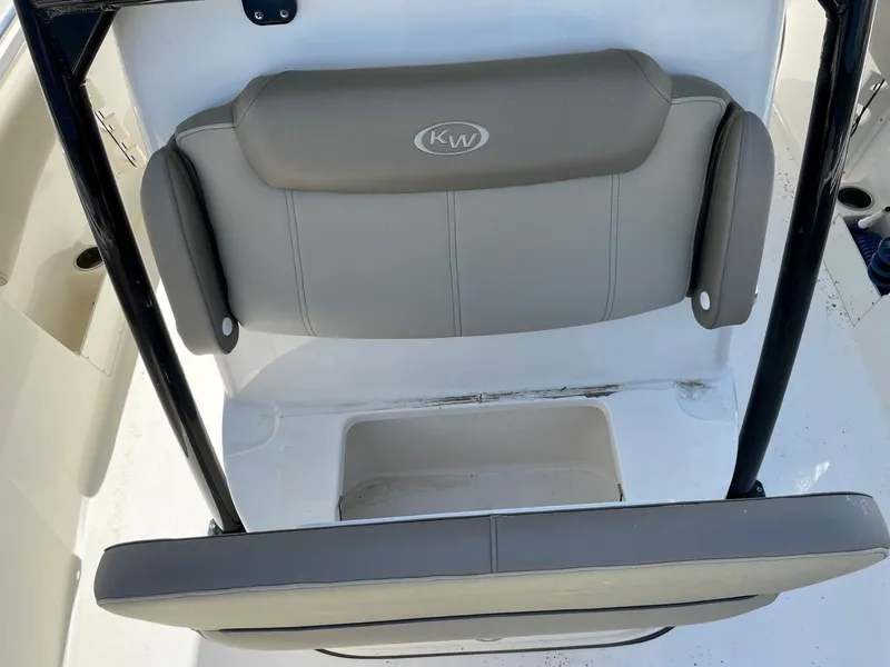 Slide: The Image of 2022 Key West 263 FS boat seat with gray upholstery and KW logo. - 10