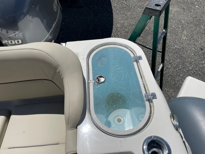 Slide: The Image of 2022 Key West 263 FS boat interior with seating and livewell. - 14