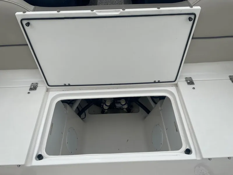 Slide: The Image of Open storage compartment on 2022 Key West 263 FS boat. - 18