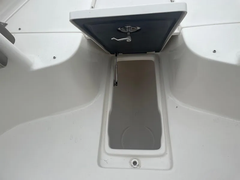 Slide: The Image of Open storage compartment on 2022 Key West 263 FS boat. - 20