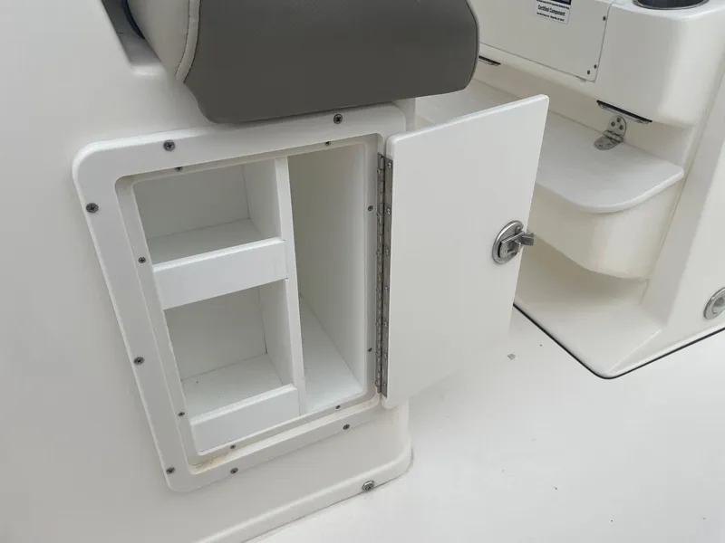 Slide: The Image of Open storage compartment on 2022 Key West 263 FS boat. - 21