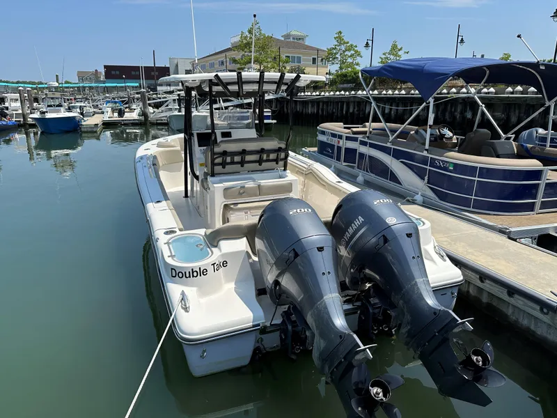 Slide: The Image of 2022 Key West 263 FS boat docked with twin Yamaha 200 engines. - 25