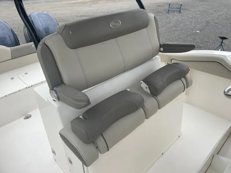 Slide: The Image of 2022 Key West 263 FS boat seating with gray upholstery and armrests. - 4