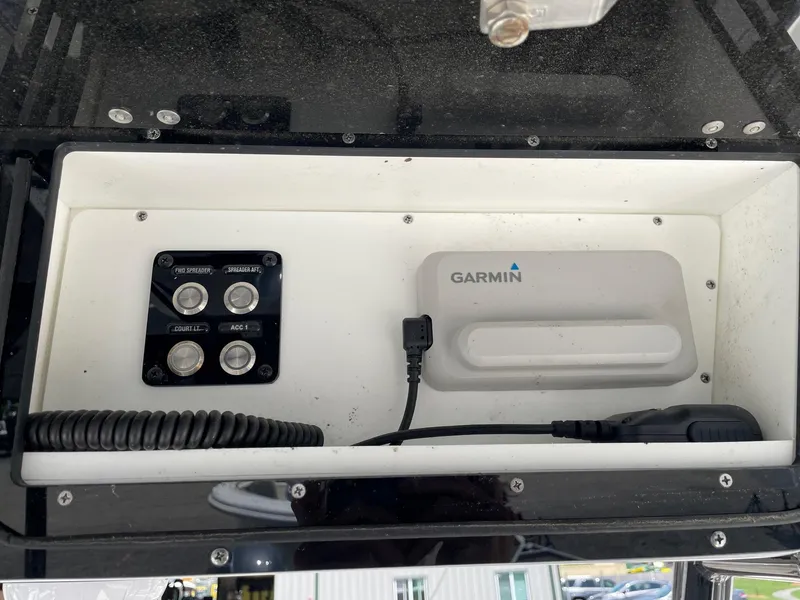 Slide: The Image of 2022 Key West 263 FS boat console with Garmin device and control panel. - 5