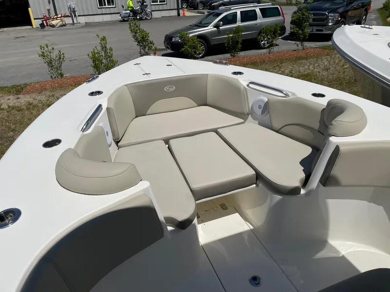 Slide: The Image of 2022 Key West 263 FS boat interior with cushioned seating and modern design. - 7