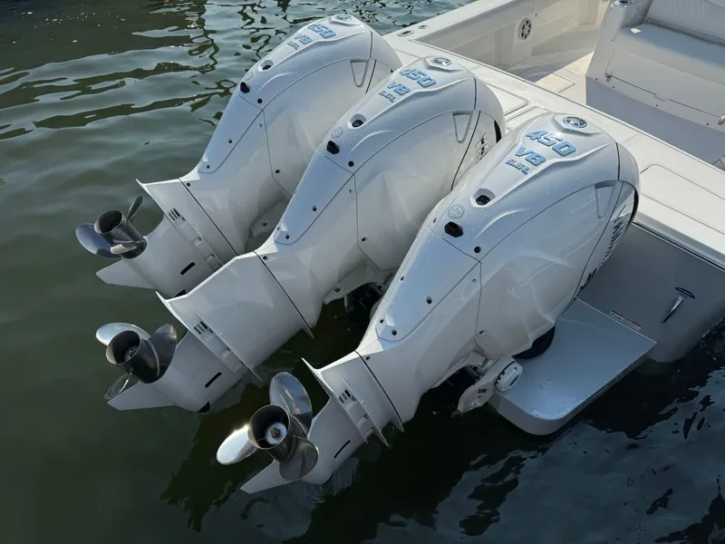 Slide: The Image of Triple outboard engines on a 2025 Regulator 37 boat. - 14