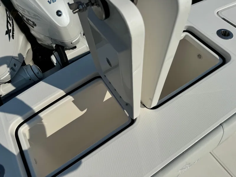 Slide: The Image of Open storage compartments on a 2025 Regulator 37 boat. - 18
