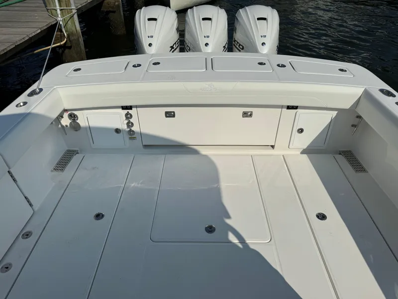 Slide: The Image of 2025 Regulator 37 boat deck with triple outboard engines. - 20