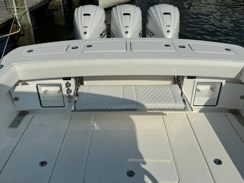 Slide: The Image of 2025 Regulator 37 boat with triple outboard engines and spacious deck. - 21