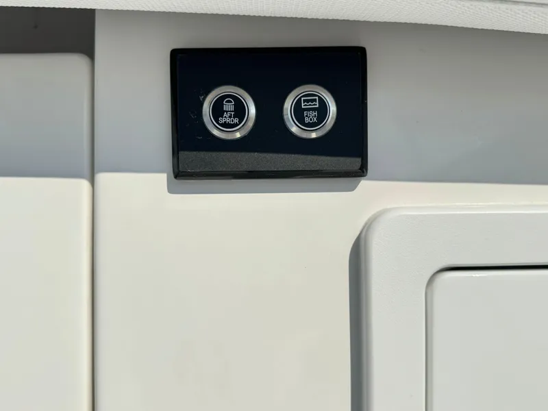 Slide: The Image of 2025 Regulator 37 boat control panel with mist sprayer and fish box buttons. - 23