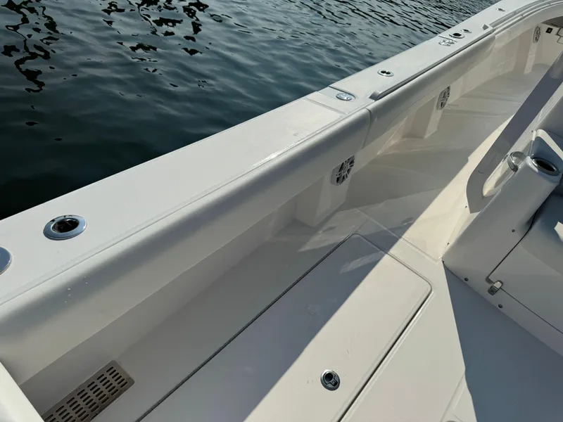 Slide: The Image of 2025 Regulator 37 boat deck with water in the background. - 32