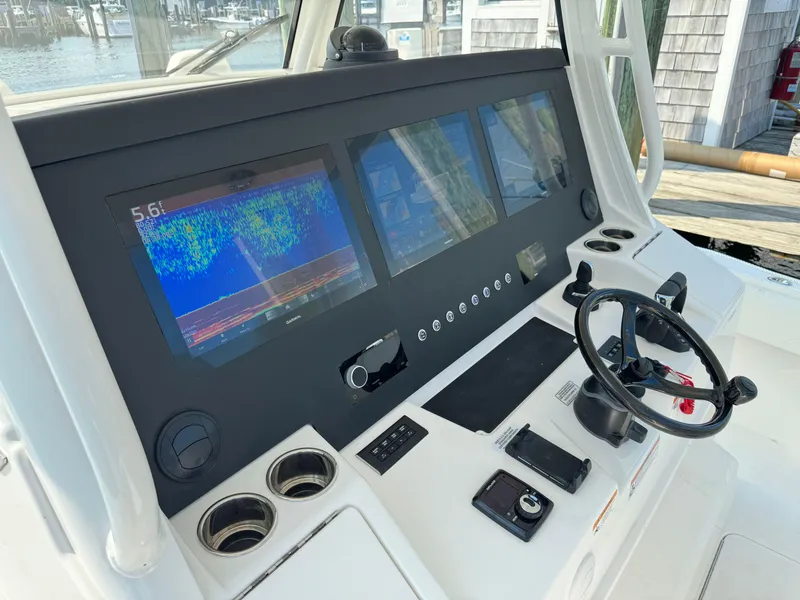Slide: The Image of 2025 Regulator 37 boat dashboard with advanced navigation and control systems. - 37
