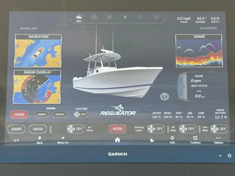 Slide: The Image of Garmin display showing Regulator 37 boat navigation and sonar systems. - 39