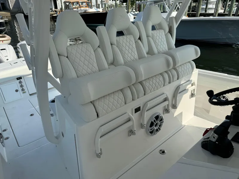 Slide: The Image of Luxury seating on the 2025 Regulator 37 boat with white quilted upholstery. - 41