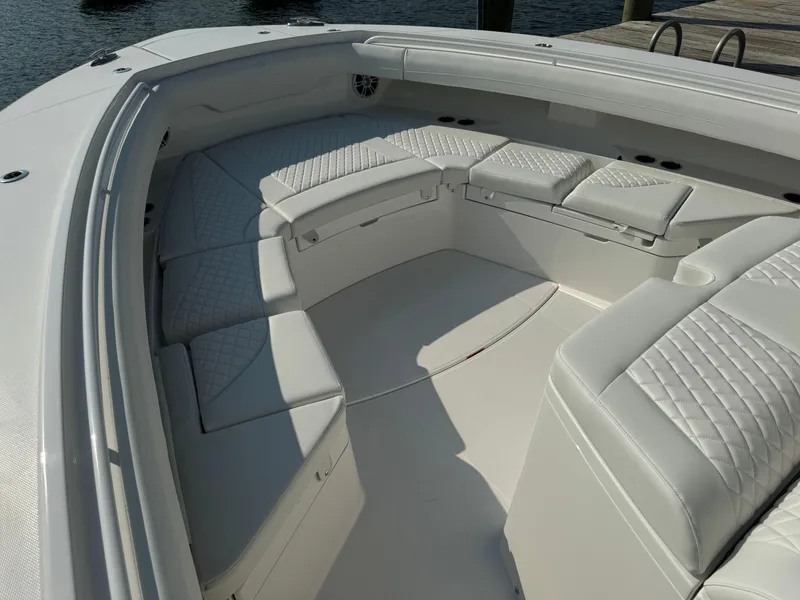 Slide: The Image of 2025 Regulator 37 boat with luxurious white seating and spacious deck. - 45