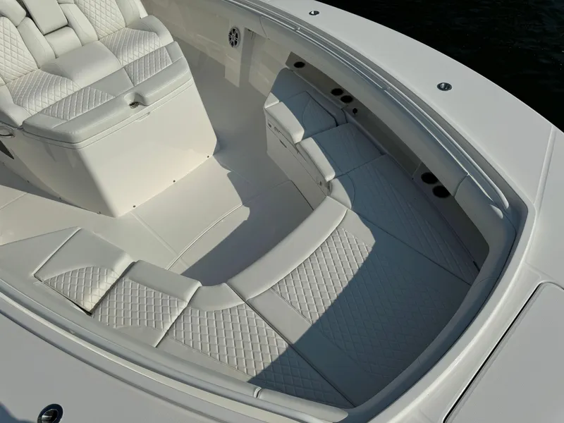Slide: The Image of Luxurious seating area on the 2025 Regulator 37 boat with white quilted upholstery. - 47
