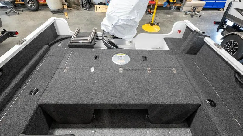 Slide: The Image of 2025 Lund 1650 Rebel XL SS boat interior with storage compartments. - 13