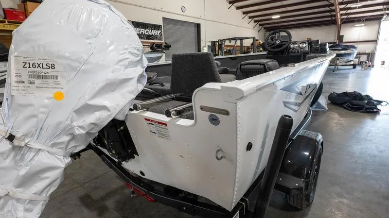 Slide: The Image of 2025 Lund 1650 Rebel XL SS boat in a warehouse, rear view. - 18