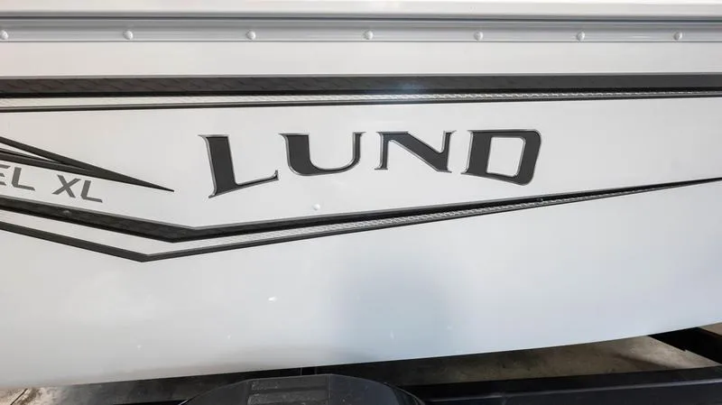 Slide: The Image of 2025 Lund 1650 Rebel XL SS boat side view with logo. - 20