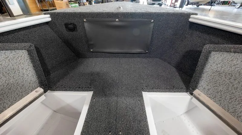 Slide: The Image of 2025 Lund 1650 Rebel XL SS boat interior with storage compartments. - 3