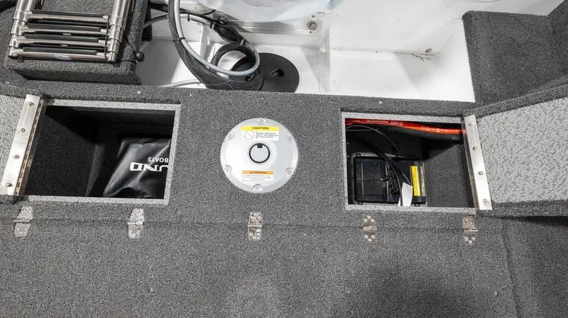Slide: The Image of 2025 Lund 1650 Rebel XL SS boat storage compartments and battery area. - 5