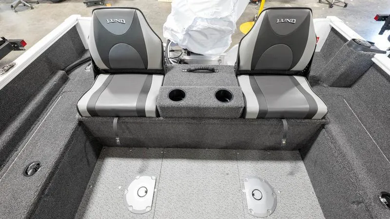 Slide: The Image of 2025 Lund 1650 Rebel XL SS boat interior with dual seats and cup holders. - 9