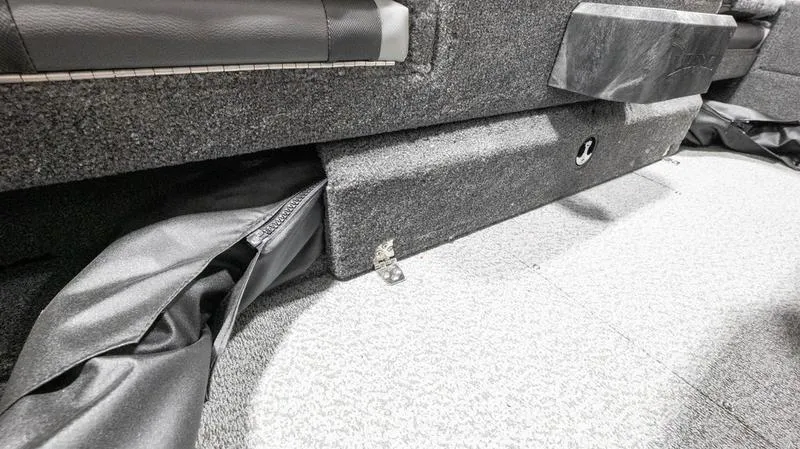 Slide: The Image of 2024 Lund 1875 Impact XS Sport interior storage compartment. - 13