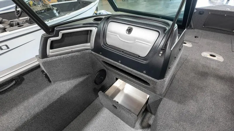 Slide: The Image of 2024 Lund 1875 Impact XS Sport boat interior with storage compartments. - 23