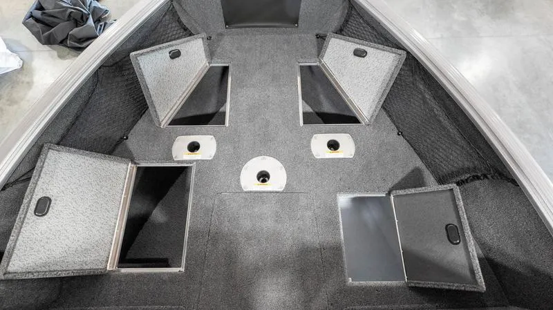 Slide: The Image of 2024 Lund 1875 Impact XS Sport boat interior storage compartments. - 4