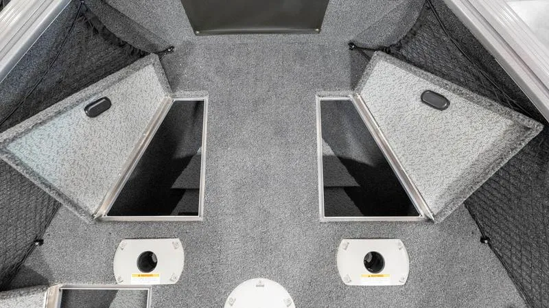 Slide: The Image of 2024 Lund 1875 Impact XS Sport boat interior storage compartments. - 9