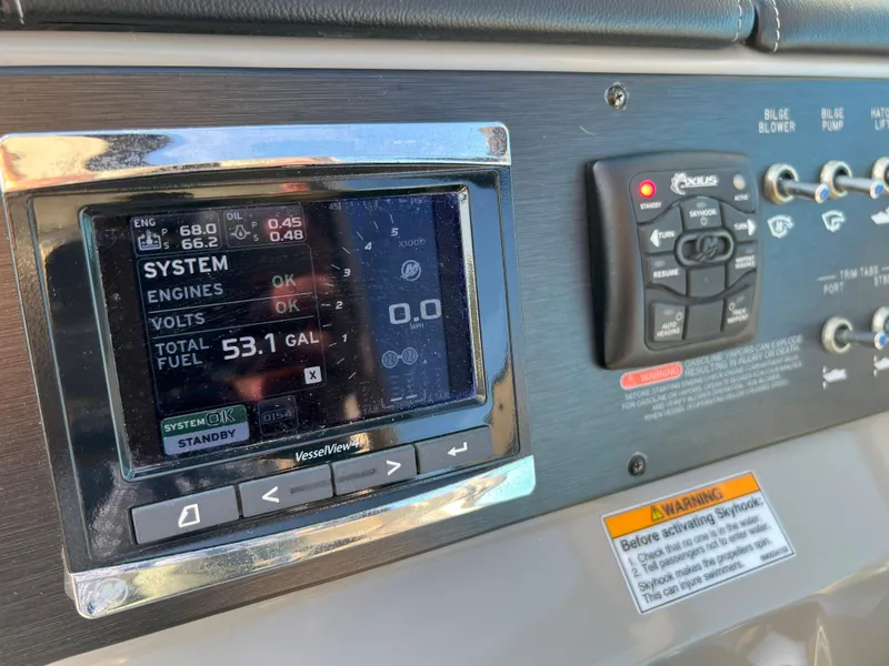 Slide: The Image of Control panel of a 2014 Sea Ray 350 Sundancer boat displaying system information. - 14