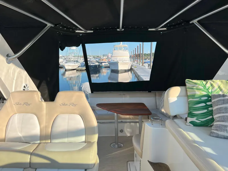 Slide: The Image of Interior view of 2014 Sea Ray 350 Sundancer yacht with marina backdrop. - 24