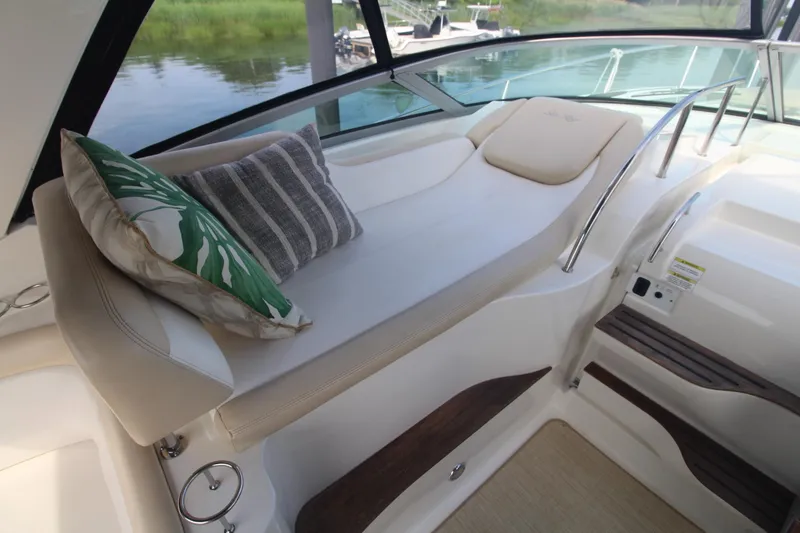 Slide: The Image of Luxurious seating area on a 2014 Sea Ray 350 Sundancer yacht with decorative pillows. - 27