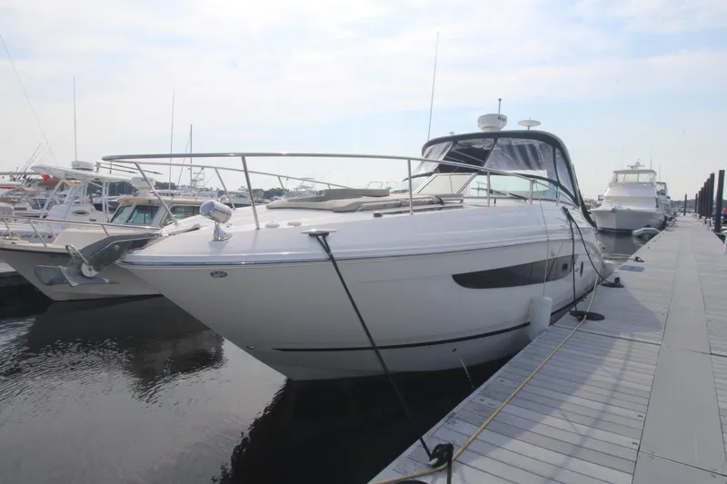 Slide: The Image of 2014 Sea Ray 350 Sundancer yacht docked at marina, side view. - 3