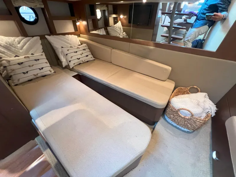 Slide: The Image of Interior of 2014 Sea Ray 350 Sundancer yacht with cozy seating and elegant decor. - 35