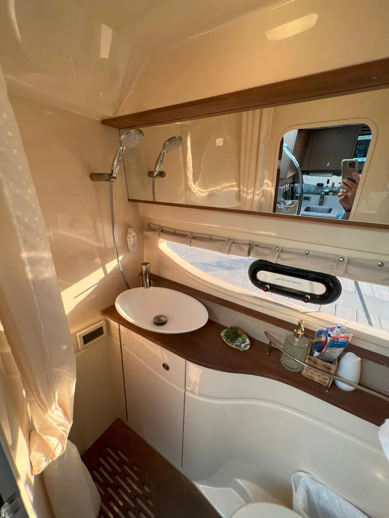 Slide: The Image of Luxurious bathroom interior of 2014 Sea Ray 350 Sundancer yacht with modern fixtures. - 42